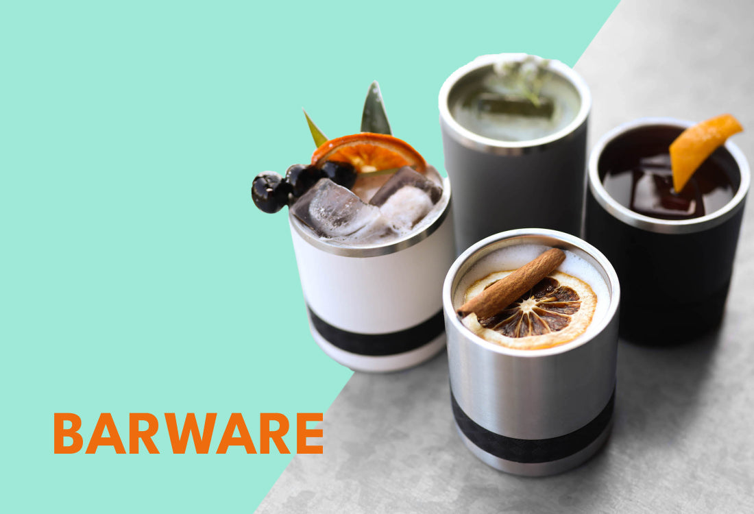 Barware cups with drinks and garnish on mint background.