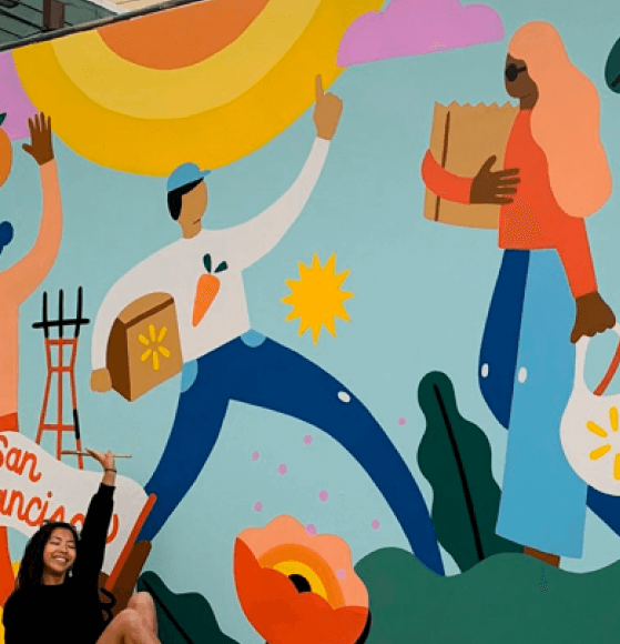 Artist creating a vibrant community mural